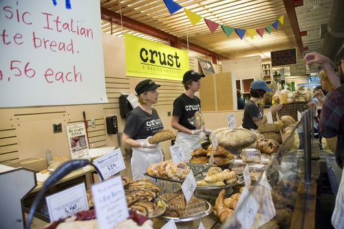 The image of a bread stand made by Crust at the Flint farmer market. 